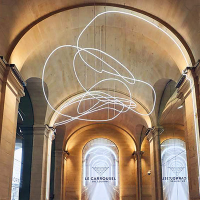 Signs, chandelier and signage of the Carrousel du Louvre.